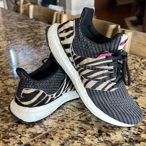 Adidas Ultra Boost zebra accent shoes.